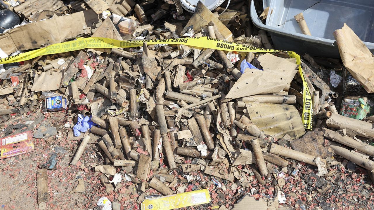 Fireworks debris is seen at the home where a New Year's Eve fireworks explosion killed and injured people, Wednesday, Jan. 1, 2025, in Honolulu. (AP Photo/Marco Garcia)