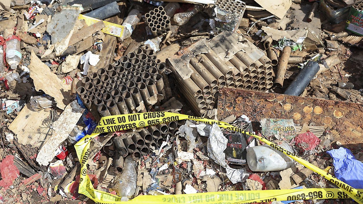 Fireworks debris is seen outside the home where a New Year's Eve fireworks explosion killed and injured people, Wednesday, Jan. 1, 2025, in Honolulu. (AP Photo/Marco Garcia)