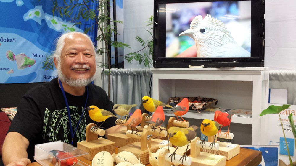 Master carver Haruo Uchiyama created a complete set of historically known Hawaiian honeycreepers for the "’Lele o Nā Manu: The Splendor and Loss of Hawaii’s Birds" exhibit. (Photo courtesy of Bishop Museum)