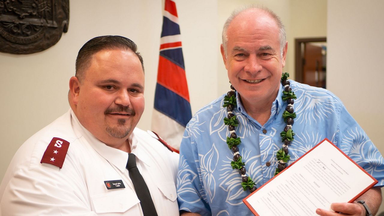 Captain Sam LeMar, Hawaii County Coordinator for the Hilo Homeless Shelter, standing with Hawaii County Mayor Mitch Roth (Photo courtesy of the Salvation Army)