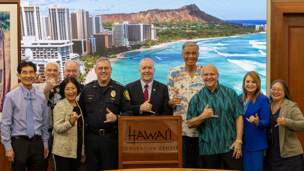 Pictured left to right: Waikiki Business Improvement District Board Chair Paul Kosasa; Hawaii Visitors and Convention Bureau Senior Vice President of Marketing & Chief Marketing Office Jay Talwar (back); Waikiki Improvement Association President Rick Egged; Hawaii State Senator Sharon Moriwaki; Honolulu Police Department Chief Arthur “Joe” Logan; City and County of Honolulu Prosecutor Steve Alm; Hawaii Tourism Authority Board Chair and Hawaii Lodging & Tourism Association President and CEO Mufi Hannemann; Honolulu Mayor Rick Blangiardi; and Visitor Aloha Society of Hawaii President and CEO Jessica Lani Rich. (Photo courtesy of Hawaii Tourism Authority)