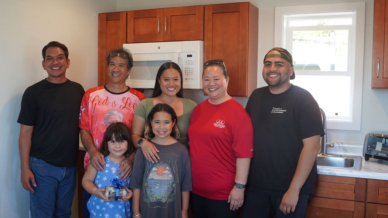 The Ah Pucks, who are standing with staff from the Council for Native Hawaiian Advancement, were fourth-generation owners of Nagasako General Store and one of the oldest tenants at The Old Lahaina Center. The General Store is now gone because of the wildfires. (Photo courtesy of Gov. Green’s office)