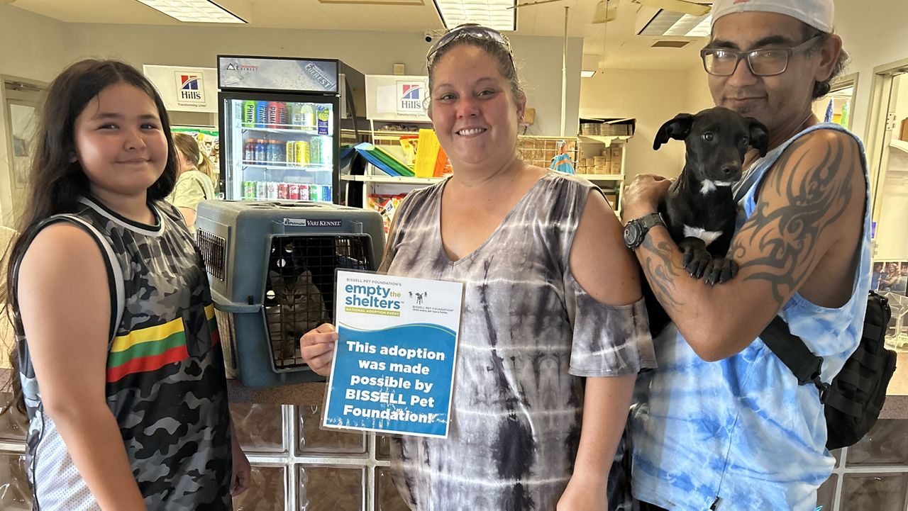 A family adopts a cat and dog during Kauai Humane Society's "Empty the Shelter" event in 2023. (Photo courtesy of Kauai Humane Society)