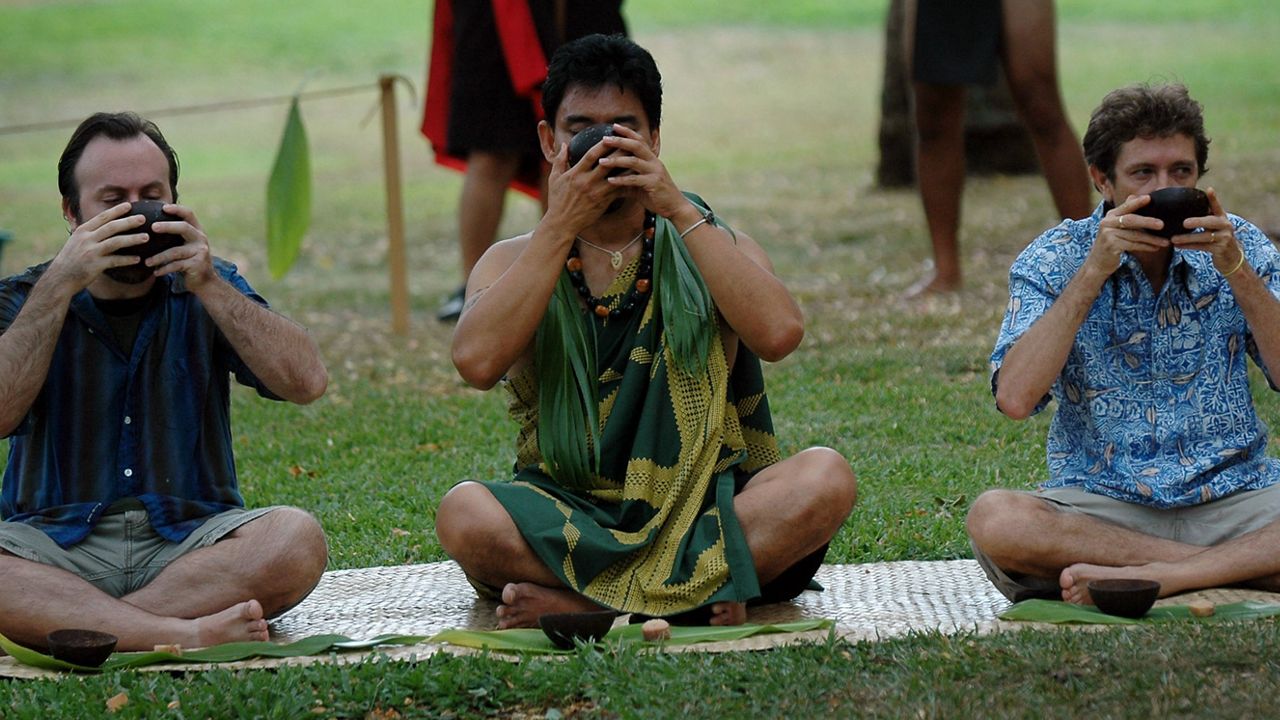 Participants taste kava at a traditional drinking ceremony at the Kava Festival in Honolulu, Oct. 7, 2006. (AP Photo/Lucy Pemoni)