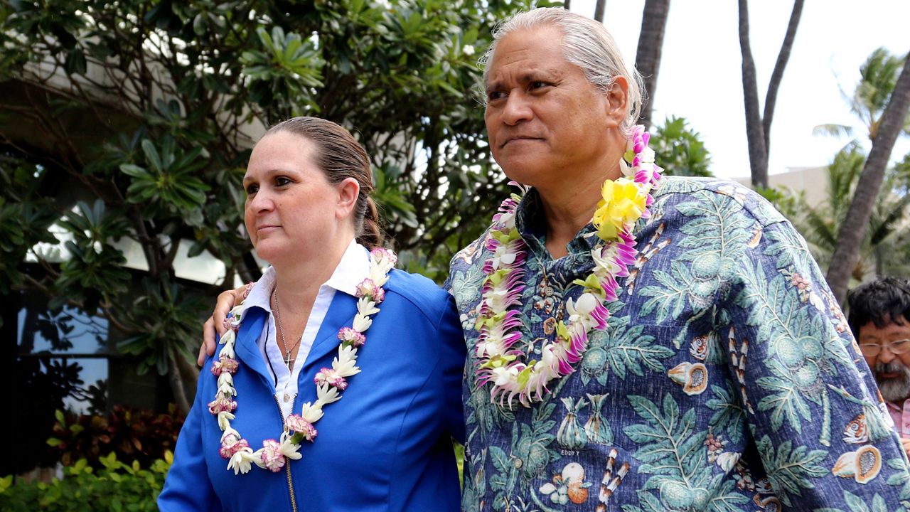 In this Oct. 20, 2017, file photo, former Honolulu Police Chief Louis Kealoha, right, and his wife, Katherine, leave federal court in Honolulu. (AP Photo/Caleb Jones, File)