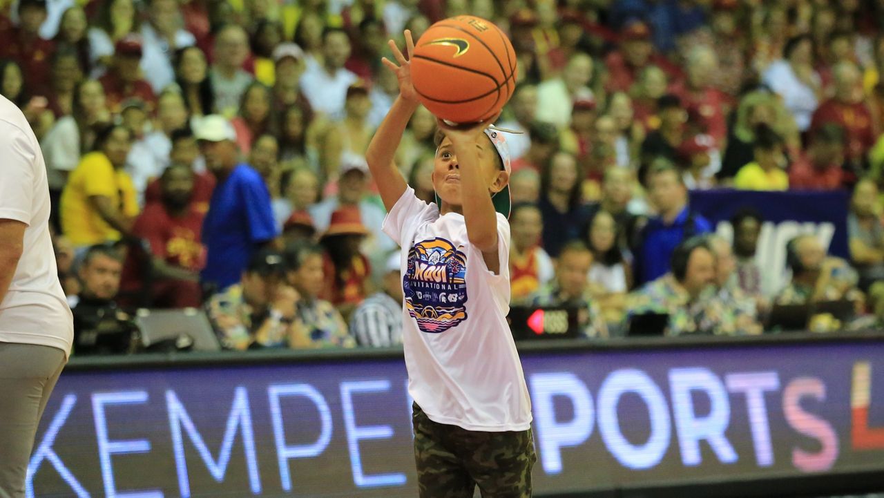 A Maui keiki competed in a contest during a timeout at the Maui Invitational basketball tournament at the Lahaina Civic Center on Tuesday.