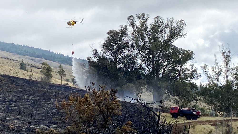 Crews worked throughout the weekend with the assistance of helicopters and heavy equipment. (Photo courtesy of DLNR)