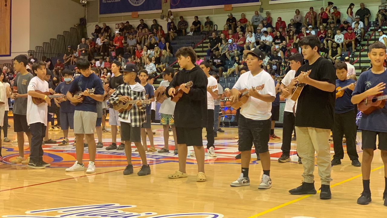 Local ukulele players performed at halftime of a 2022 Maui Invitational game at the Lahaina Civic Center.