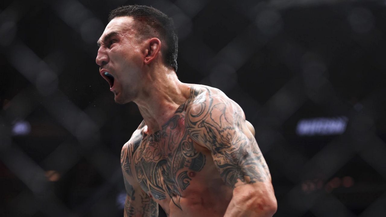 Waianae's Max Holloway celebrated after knocking out Justin Gaethje in the final second of their BMF belt lightweight fight at UFC 300 at T-Mobile Arena in Las Vegas on Saturday night.