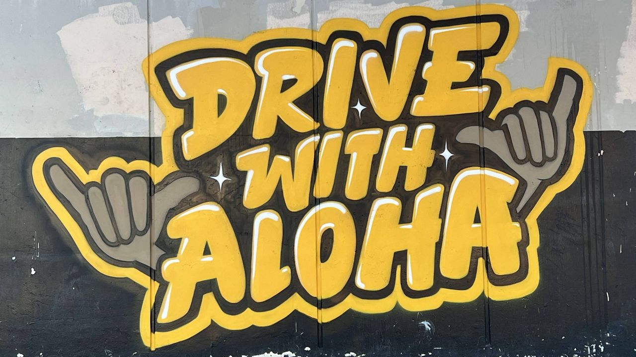 This mural, completed through the "Drive with Aloha" program at Nanakuli Intermediate and High School, faces the street where an impaired driver killed a mother and daughter. It serves as a reminder to drive safely and honors the victims. (Photo courtesy of the Hawaii Department of Transportation)