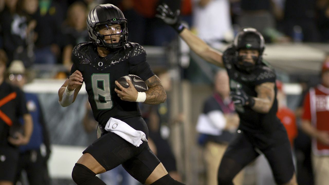 Oregon quarterback Dillon Gabriel, a Mililani High graduate, ran for a touchdown against Ohio State at Autzen Stadium in Eugene, Ore., on Saturday.