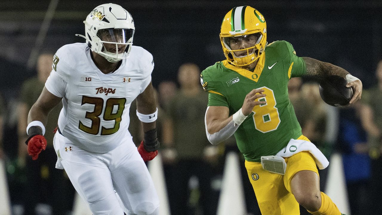 Oregon quarterback Dillon Gabriel ran the ball as Maryland defensive lineman Daniel Owens pursued at Autzen Stadium in Eugene, Ore., on Saturday.