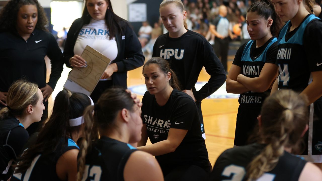 Katie Novak, center, arrived at HPU last July and led the Sharks to a PacWest first-round playoff appearance in 2022-23.