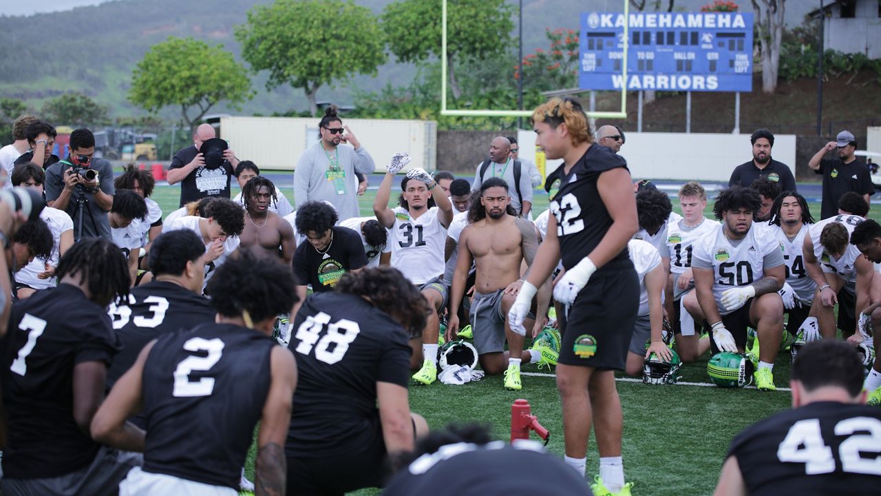 Mililani defensive lineman Alzik Mahuka led Polynesian Bowl players in a prayer at Kamehameha's Kunuiakea Stadium at practice on Wednesday.