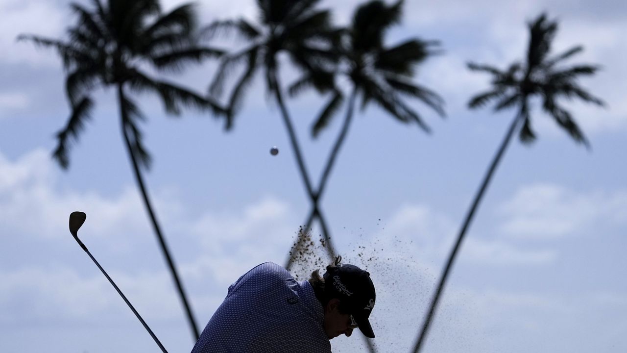 Nico Echavarria hit out of a bunker on the 16th fairway during the third round of the Sony Open at Waialae Country Club on Saturday.