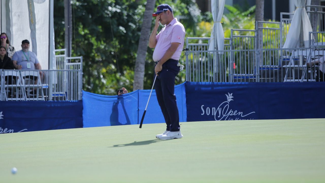 Hawaii's Chan Kim reacted after his eagle putt from 46 feet stopped a few feet short on the 18th hole on Day 2 of the Sony Open in Hawaii. Kim needed the eagle to make the cut in his first event as a full PGA Tour member; instead, he missed it by a stroke.