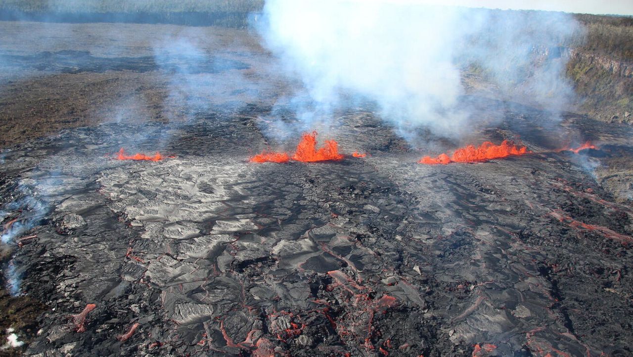 This photograph of Kīlauea's middle East Rift Zone eruption was captured during a Hawaiian Volcano Observatory helicopter overflight during the morning of Sept. 17, 2024. Geologists observed fountaining eruptive fissures and active lava flows bisecting the floor of Nāpau Crater. (Photo courtesy of USGS/N. Deligne)