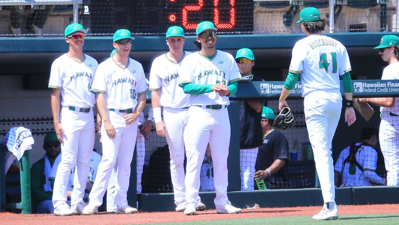 Members of the Hawaii baseball team greeted pitcher Harrison Bodendorf, right, as he came off the mound against CSUN earlier this month.