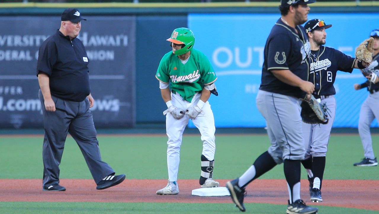 Hawaii catcher Dallas Duarte flexed in the direction of the UH dugout after his double to right in the first inning. He later came around to score in UH's 4-3 victory against Cal Poly. 