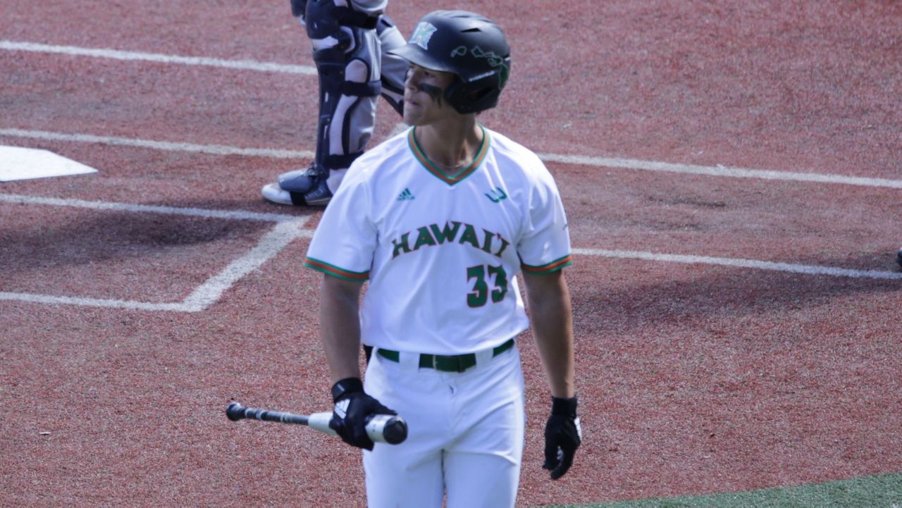 Hawaii's Tai Walton headed back to the dugout after striking out in the eighth inning as a pinch hitter.