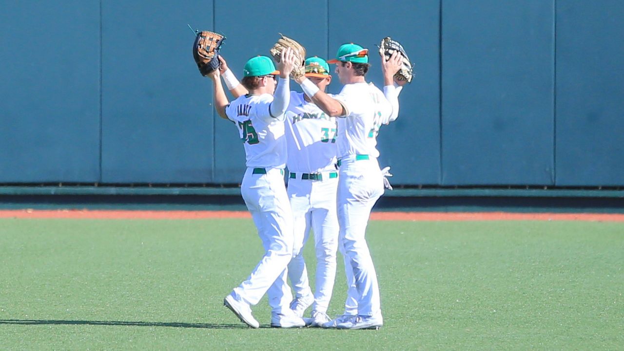 The Hawaii outfield, seen against Holy Cross in March, went into a victory pose all three outings against UC San Diego at Triton Ballpark this weekend.