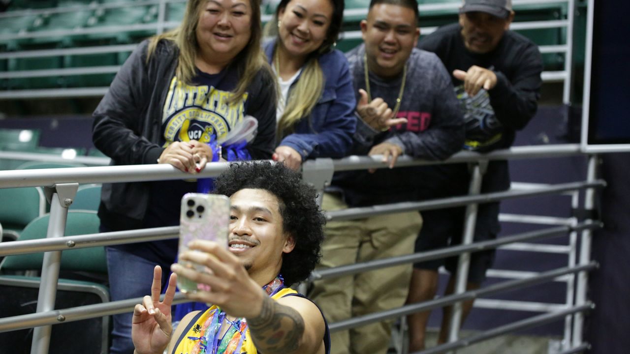 UC Irvine point guard Pierre Crockrell II posed for a selfie with friends and family, some of whom hail from Mililani, after the Anteaters earned a 60-50 road victory over Hawaii at the Stan Sheriff Center on Thursday night.