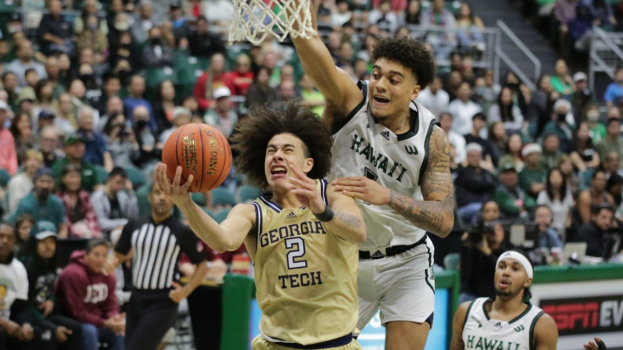 Georgia Tech guard Naithan George was fouled by Hawaii forward Justin McKoy on his way to the rim in the Yellow Jackets' Hawaiian Airlines Diamond Head Classic semifinals on Friday night.