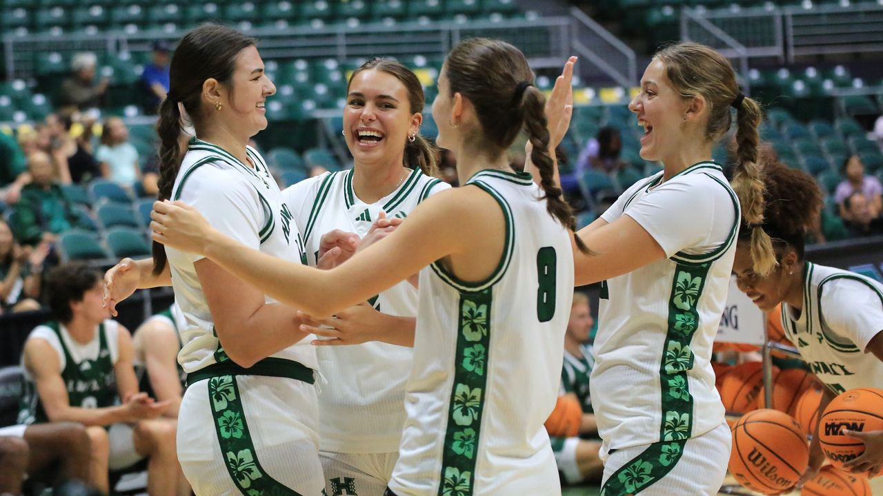 From left, center Brooklyn Rewers and wings Jade Peacock, Rebecca Moors and Danijela Kujovic, seen at the Rainbow Madness introductory event earlier this month, all scored field goals in a win against Hawaii Hilo at the Afook-Chinen Civic Auditorium in Hilo on Sunday. 