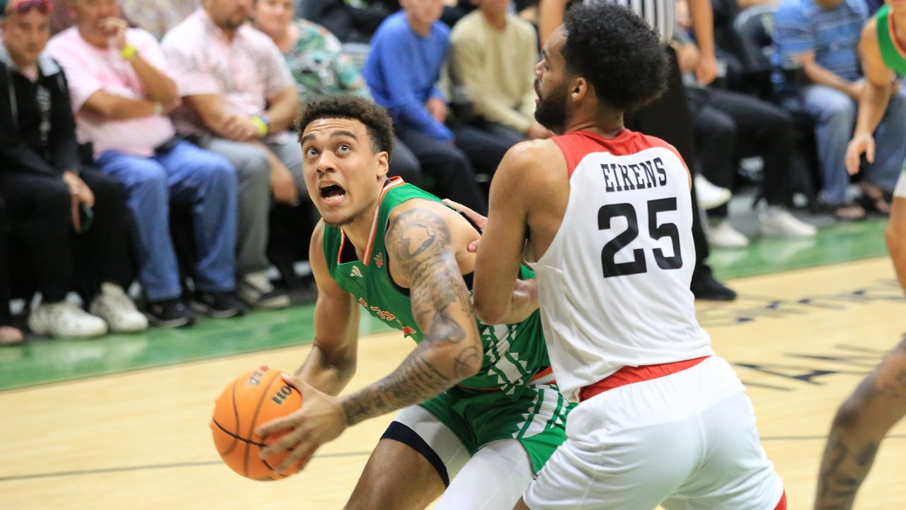 Hawaii forward Justin McKoy tried to work in the post against CSUN's De'Sean Allen-Eikens on March 6 at the Stan Sheriff Center.