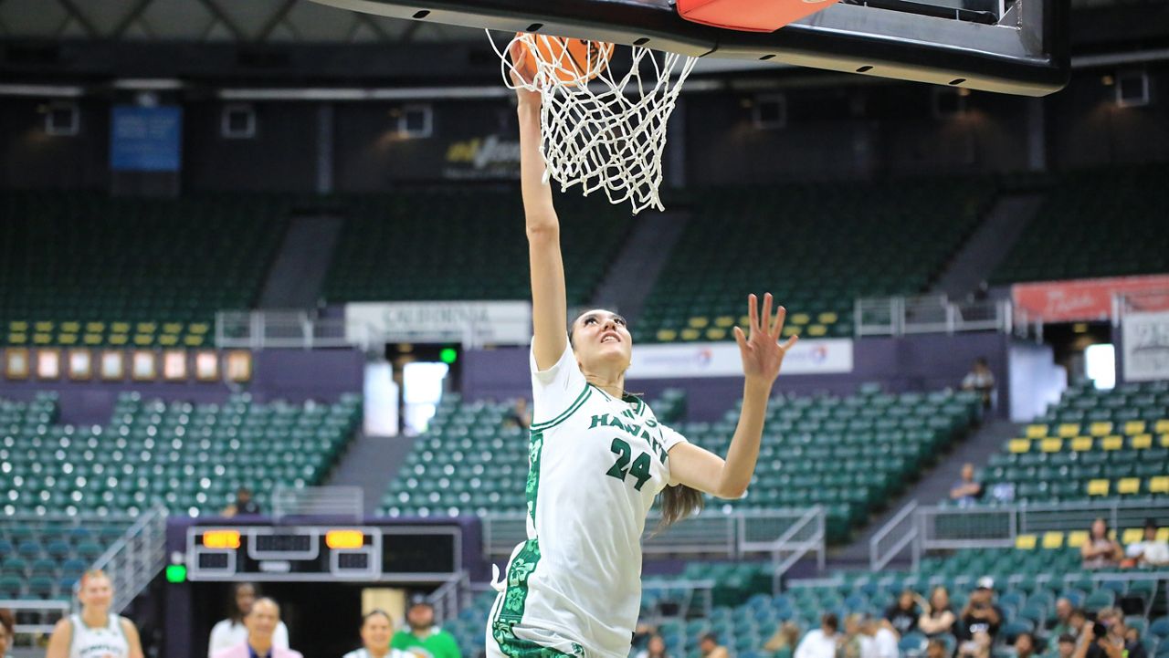 Hawaii women's basketball center Ritorya Tamilo, a native of Auckland, New Zealand, dunked the ball at the Rainbow Madness event at the Stan Sheriff Center on Saturday.