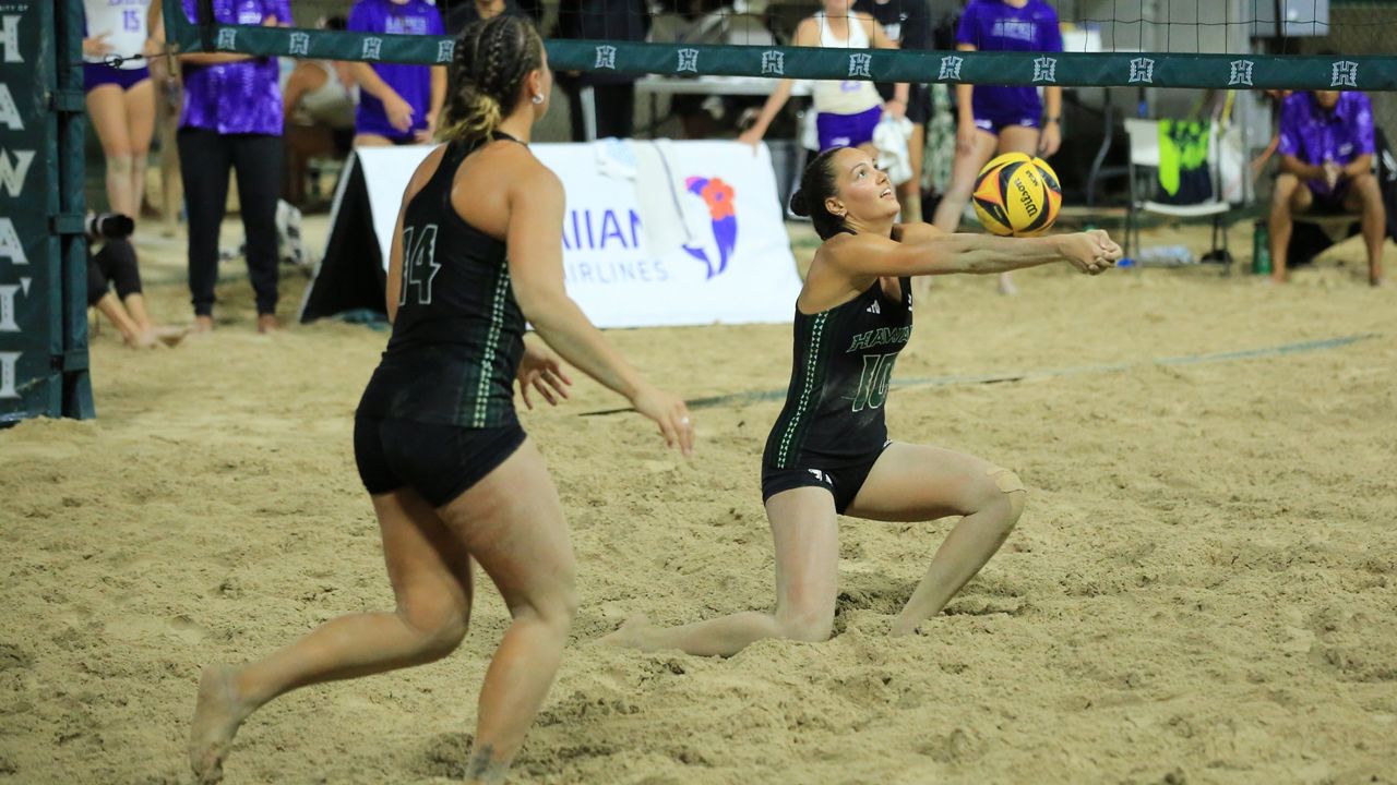 The pair of Sydney Amiatu (14) and Riley Wagoner, seen on senior night April 14, were the deciders of Hawaii's Big West championship beach volleyball match against Long Beach State on Friday.