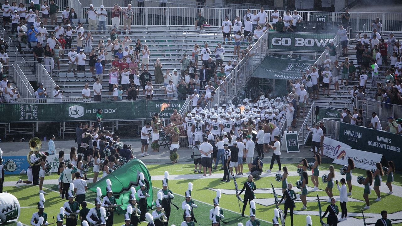 The University of Hawaii football team prepared to run onto the field for its 2023 home opener against Stanford at the Clarence T.C. Ching Athletics Complex. 