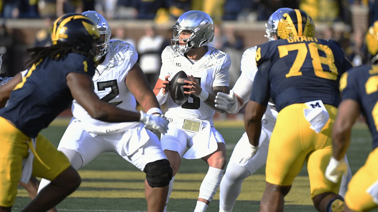 Oregon quarterback Dillon Gabriel looked to pass against Michigan in the first half at the Big House in Ann Arbor, Mich., on Saturday.