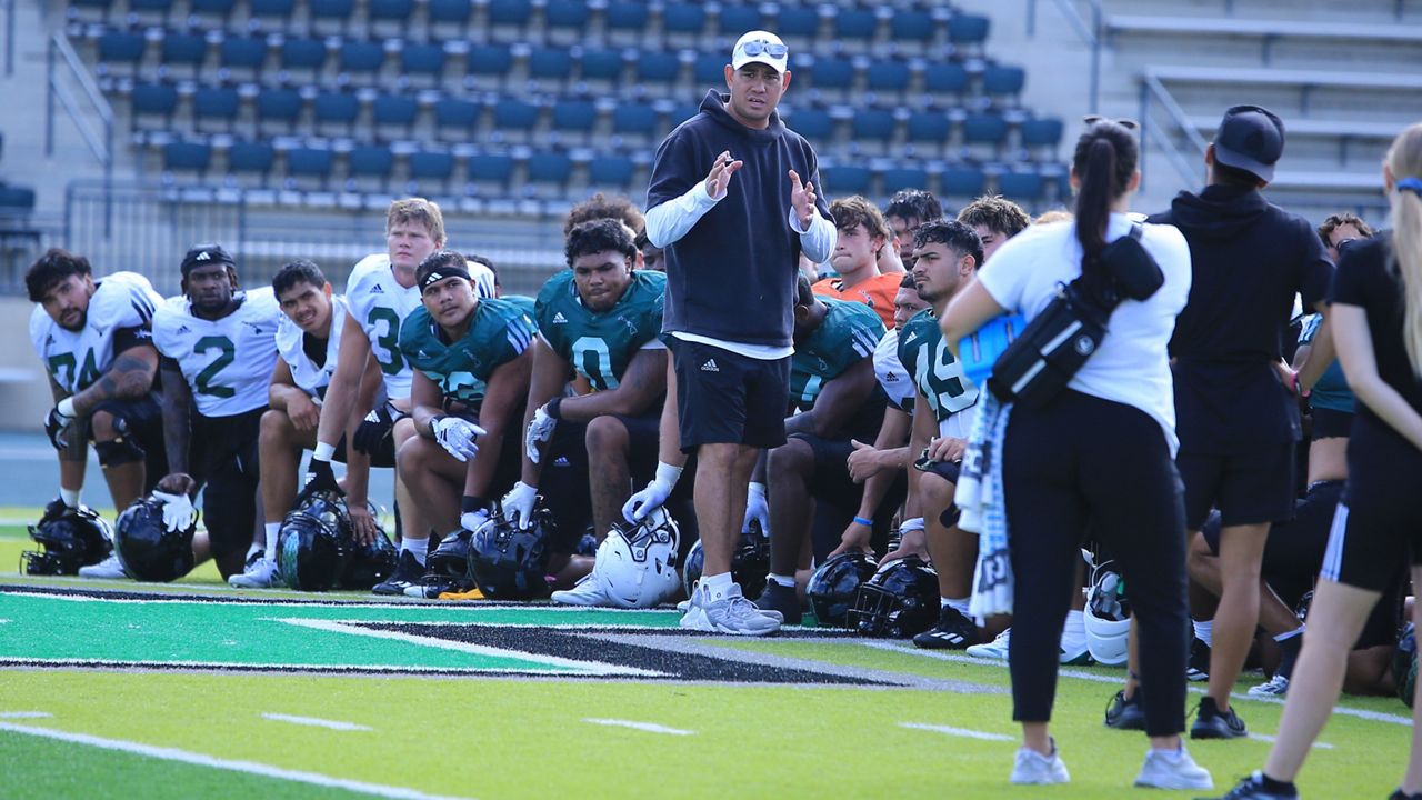 Third-year Hawaii football coach Timmy Chang made a point to his players after practice at the Clarence T.C. Ching Athletics Complex on Tuesday. UH opens the 2024 season against Delaware State of the FCS on Saturday. 