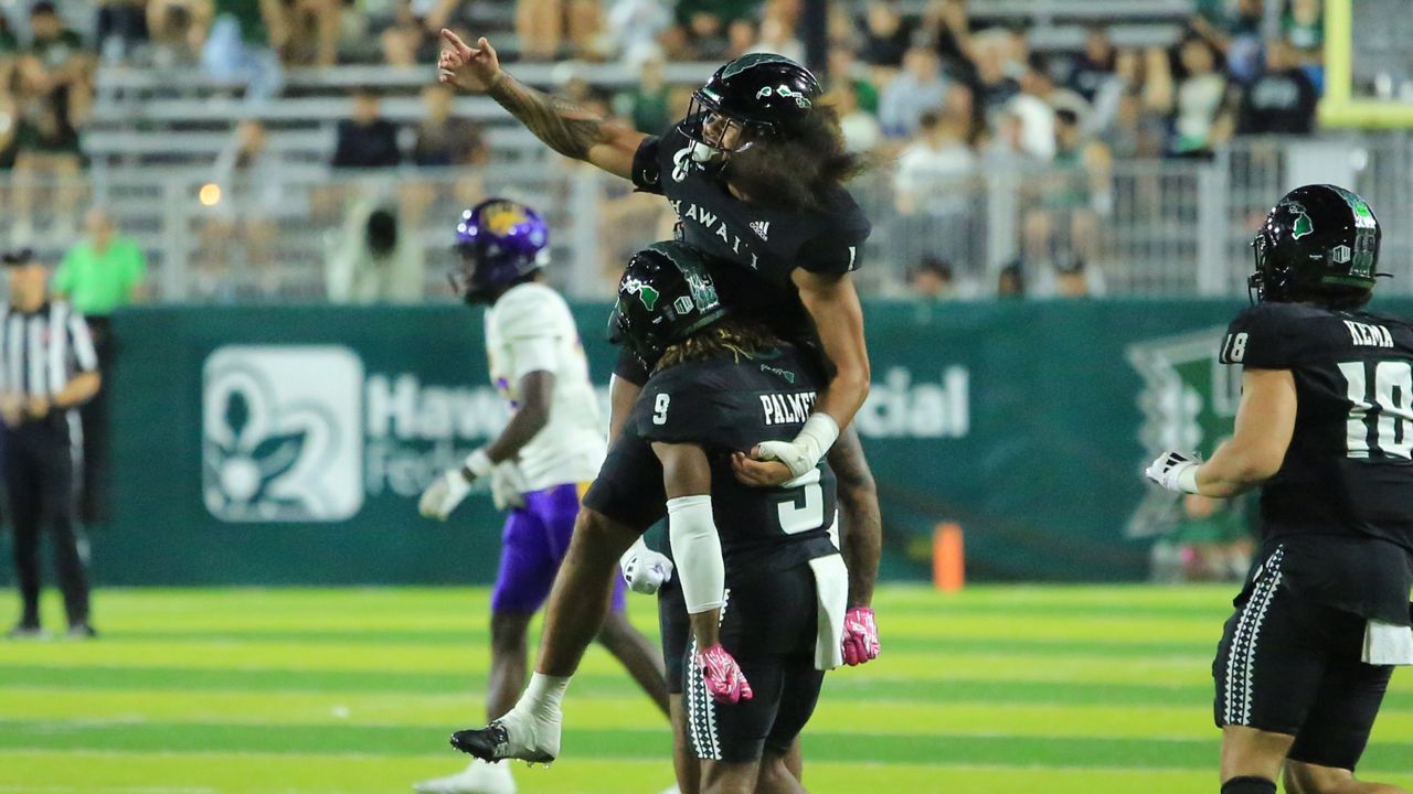 Hawaii safety Peter Manuma jumped on nickelback Elijah Palmer after a successful tackle by Palmer in the fourth quarter of the Rainbow Warriors' 36-7 win over Northern Iowa at the Clarence T.C. Ching Athletics Complex on Saturday. 