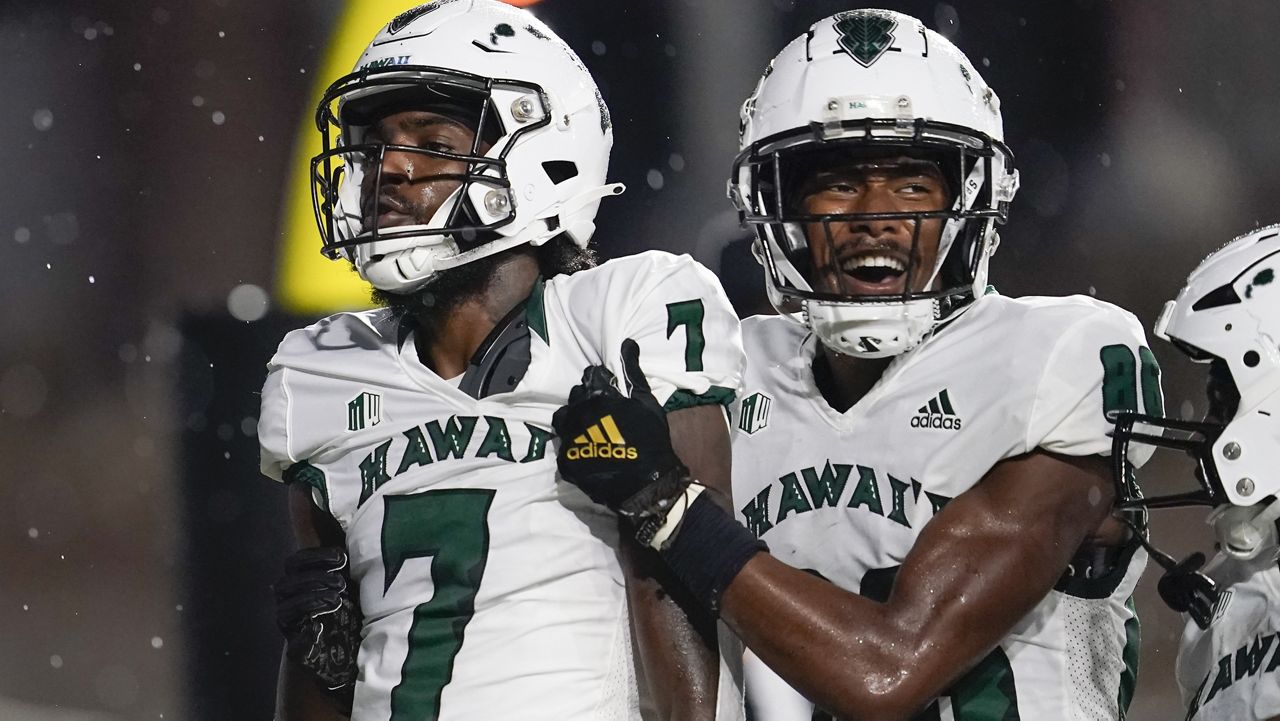 Hawaii receivers Steven McBride, left, and Pofele Ashlock combined for three touchdowns in their official UH debuts at Vanderbilt on Saturday.