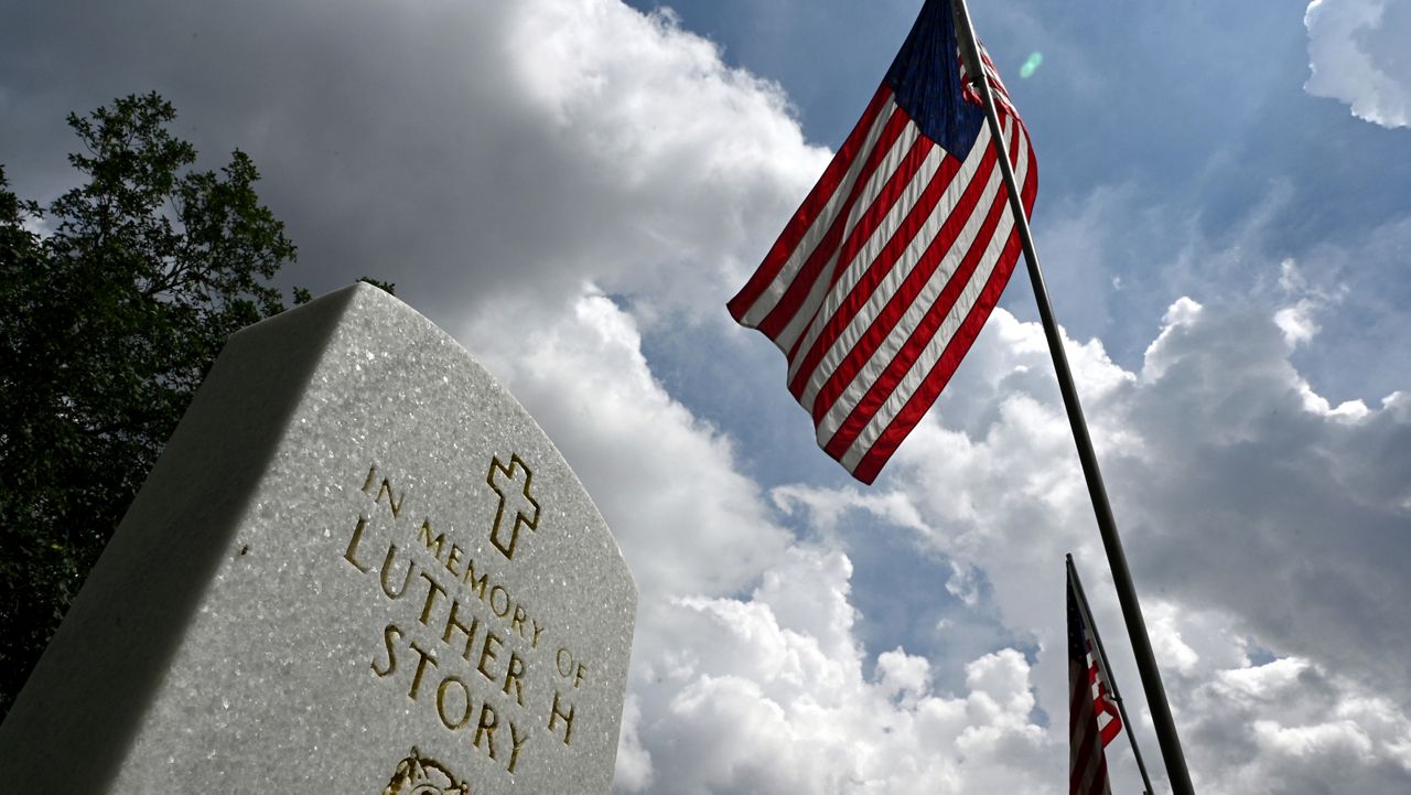 Picture shows headstone of Luther Story at Andersonville National Cemetery, Wednesday, May 17, 2023, in Andersonville, Georgia. (Hyosub Shin/Atlanta Journal-Constitution via AP)