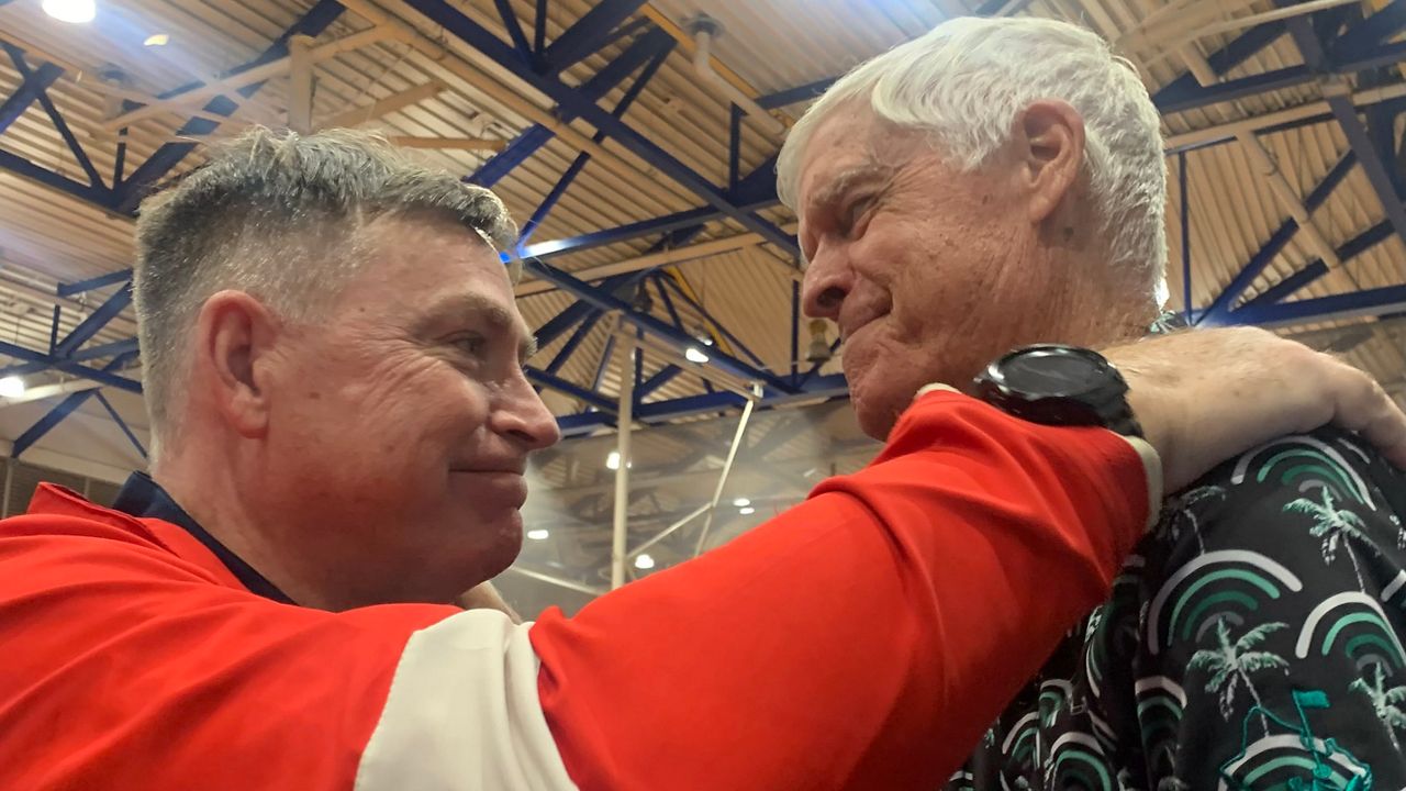 Saint Louis basketball coach Dan Hale, left, greeted his old Punahou coach, Chris McLachlin, after the Crusaders beat Kalaheo to reach a third straight HHSAA final, where they will face Darren Matsuda's Punahou team on Saturday night.