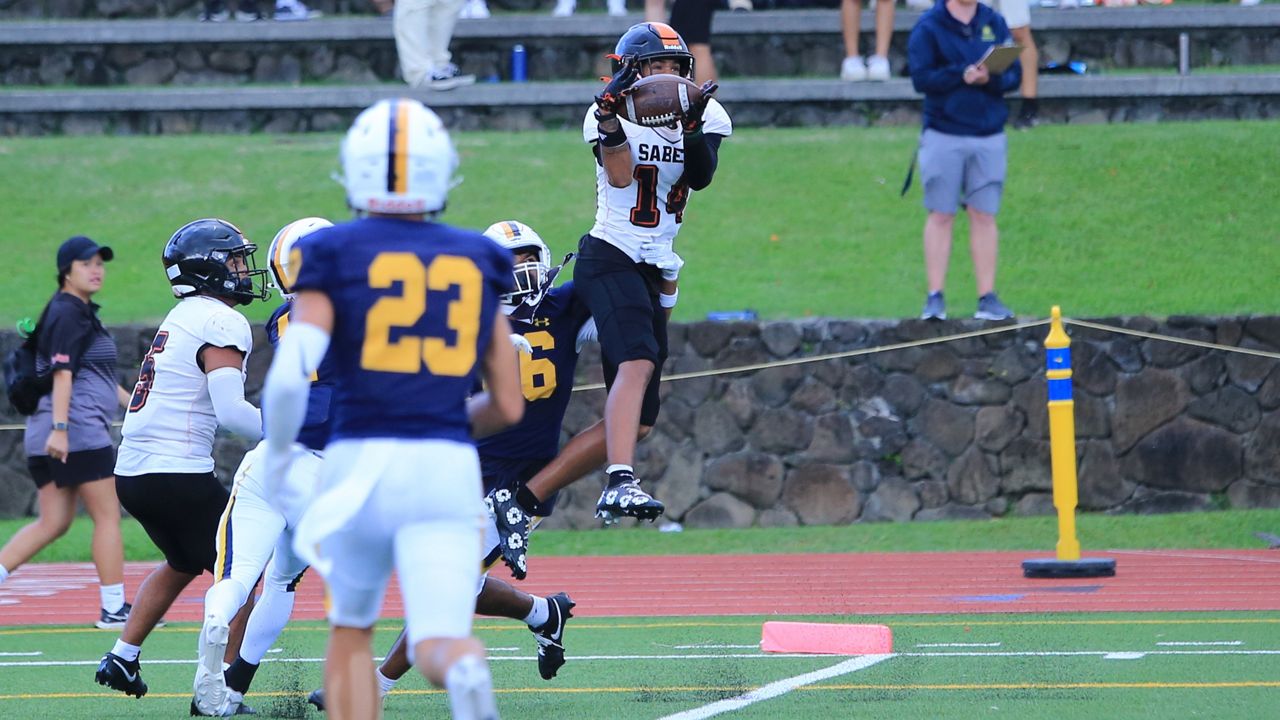 Campbell receiver Tyson Ball came down with a 22-yard touchdown pass from Jaron Keawe Sagapolutele in the third quarter of the Sabers' win at Punahou on Saturday.