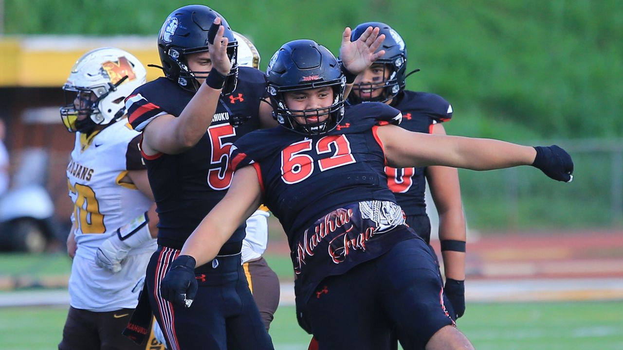 Kahuku lineman Sione Pasi reacted after recording a sack of Mililani quarterback Kini McMillan in the first half of the teams' HHSAA final at John Kauinana Stadium on Friday night.