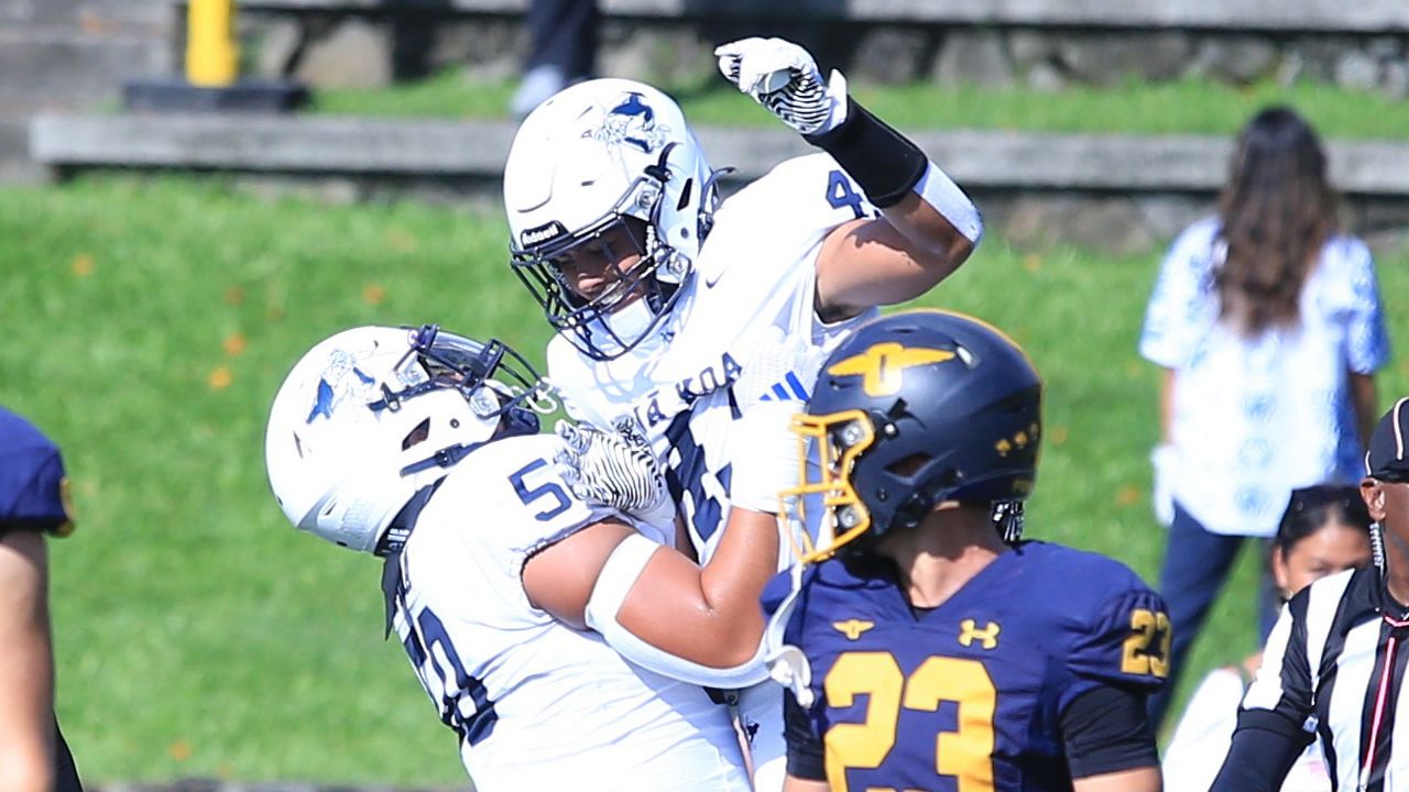 Kamehameha running back Nainoa Melchor was raised up after scoring a touchdown at Punahou's Alexander Field on Oct. 12.