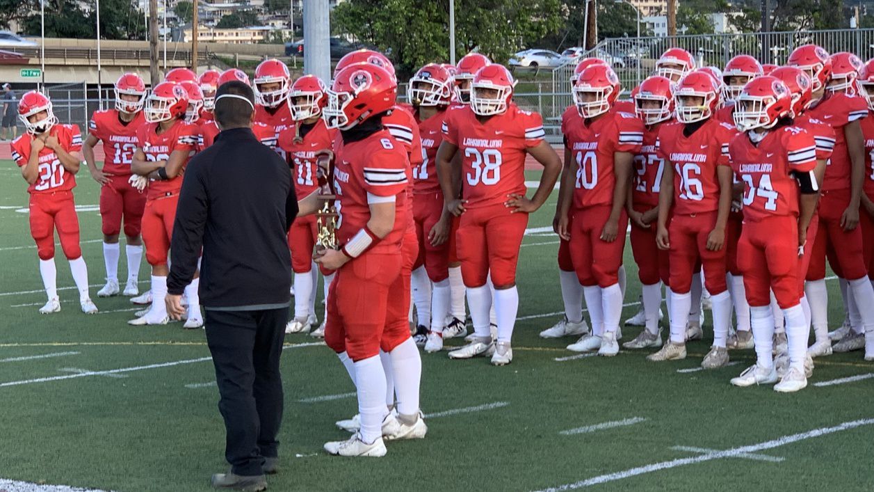 Lahainaluna players accepted the HHSAA Division I runner-up trophy in a playoff game against Iolani at Farrington in December 2021.