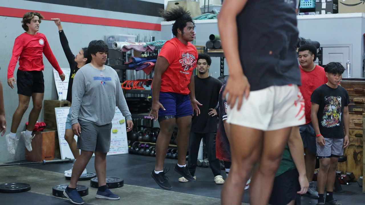 Lahainaluna football players executed standing jumps at a voluntary team workout at HI Performance Academy in Kahului on Wednesday.