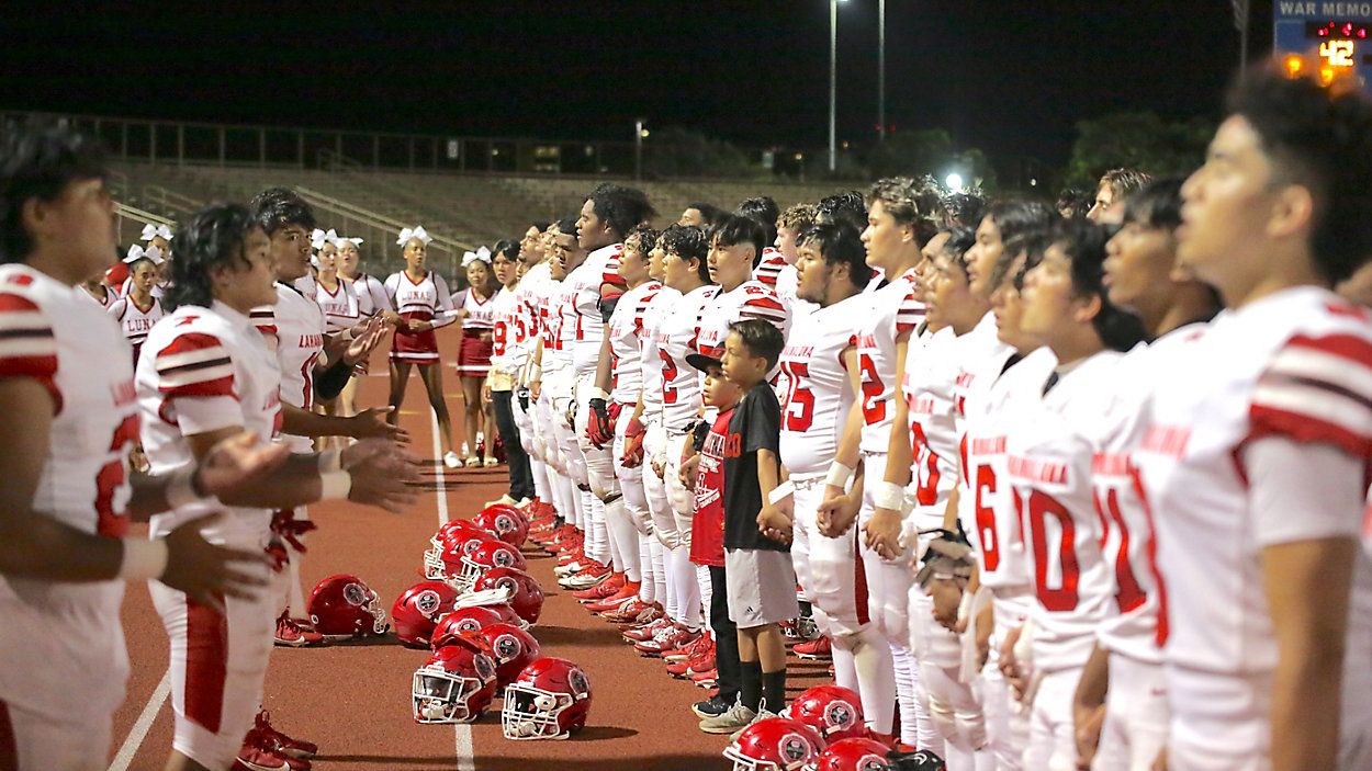 The Lahainaluna football team performed the school's alma mater after a game against Baldwin at War Memorial Stadium in Wailuku on Sept. 30, 2023. It was the team's first game after wildfires destroyed much of Lahaina town.