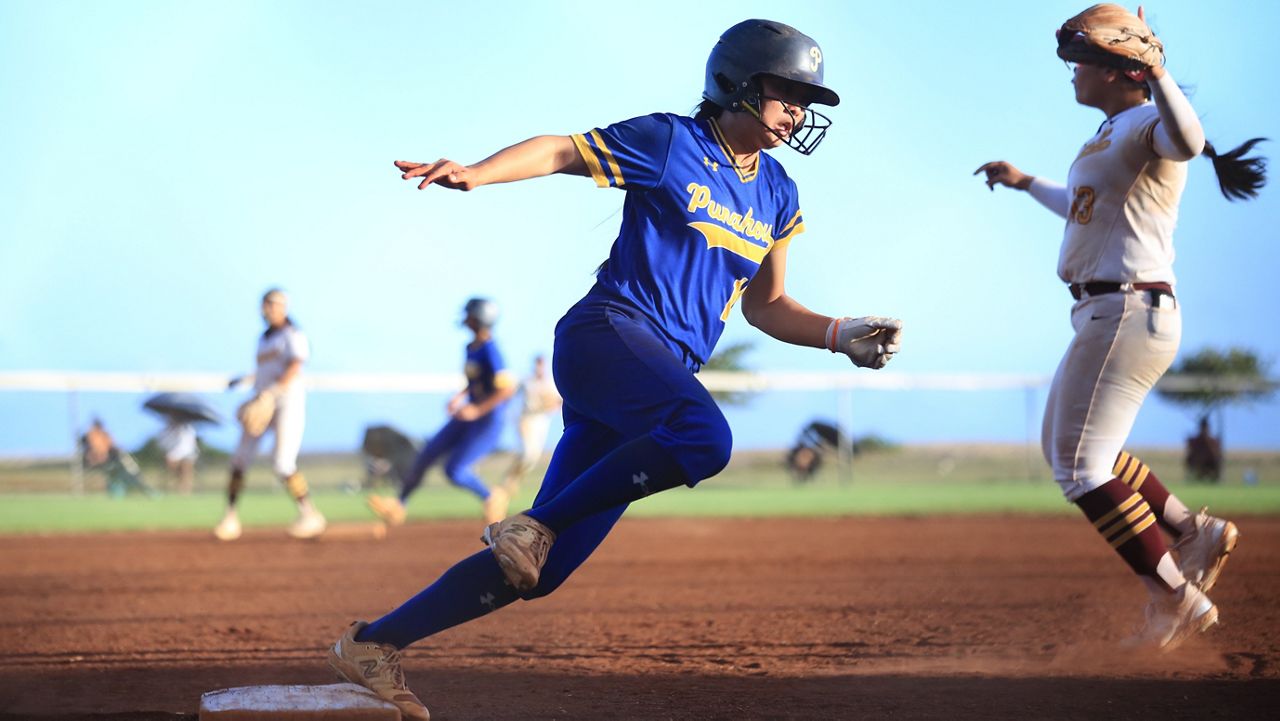 Punahou's Lexi Hinahara rounded third base and came in to score on Shayla Yamashita's single in the top of the ninth inning at Sand Island Park on Tuesday.