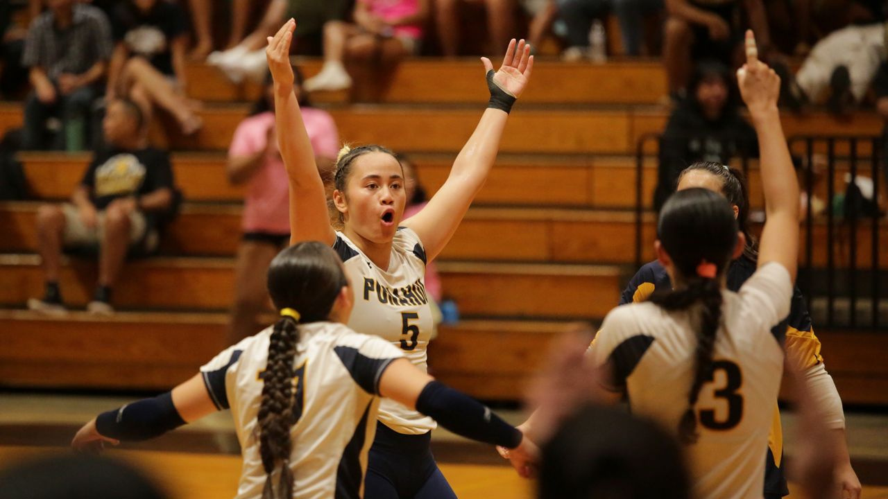 Punahou hitter Lulu Uluave raised her hands after delivering the walk-off service ace against Mililani in the New City Nissan/HHSAA Division I girls volleyball quarterfinals at McKinley on Wednesday night.