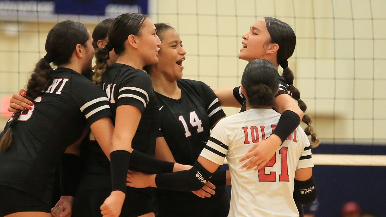 Iolani players reacted after setter Bailey Nakanelua, top right, recorded a block against Kamehameha in the teams' ILH match on Friday night.