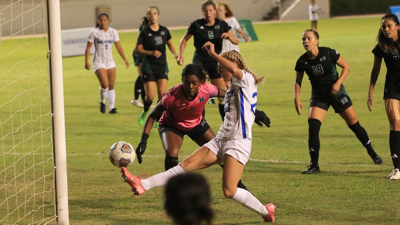 Air Force's Eleanor Musgrove tried to cut a shot around Hawaii goalkeeper Kennedy Justin at the near goalpost in the first half, but her shot hit off the post. 