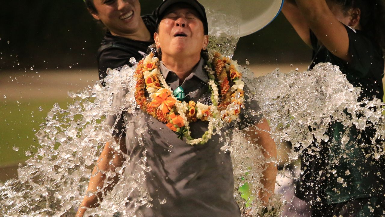 Hawaii coach Michele Nagamine got a jug of ice water poured on her after her Rainbow Wahine beat UC Davis 2-1 on her birthday Thursday night.