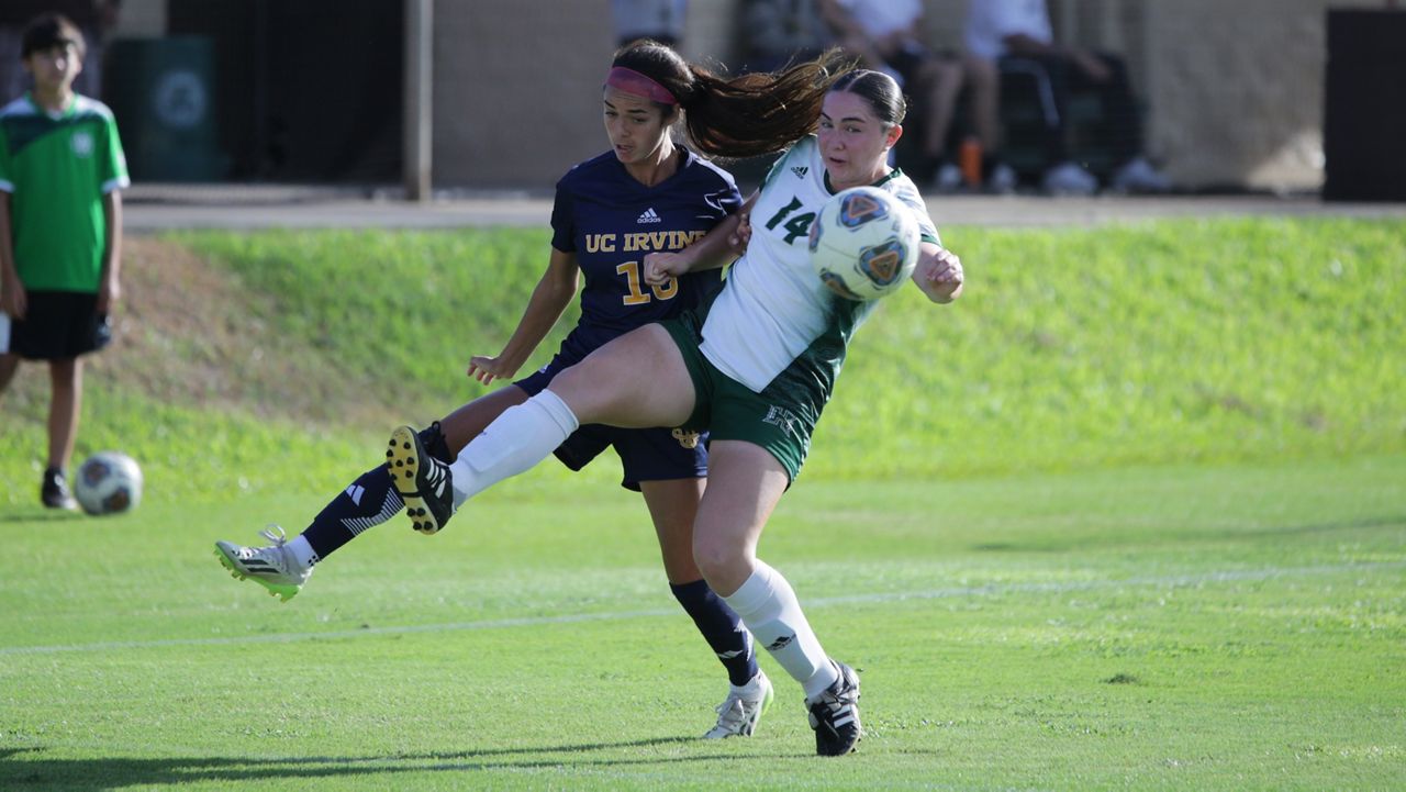 UC Irvine's Tati Fung and Hawaii's Izzy Ayala jostled for the ball in UH territory in the first half at Waipio Peninsula Soccer Stadium on Sunday. Fung was born in Honolulu and moved away when she was 9.